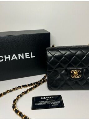 CHANEL Black Quilted Leather Mini Flap Bag with Gold Chain